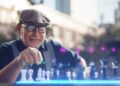 Meta vision - an old Man using AR Glasses to play chess